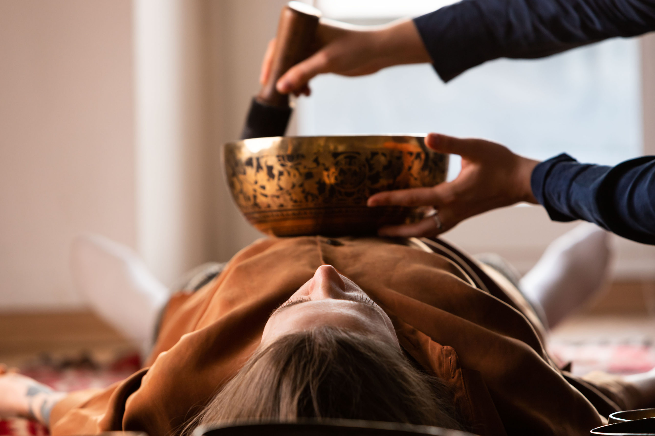 Holistic Tibetan bowls sound healing therapy at Sundara Spa, a relaxing massage spa McAllen TX experience.
